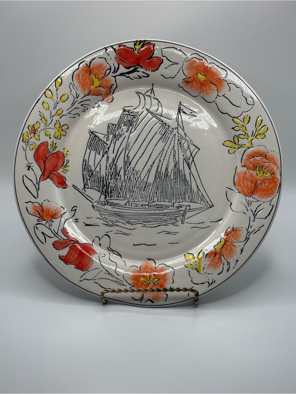 Anthropologie White Plate with Red-Orange Floral Border and Black Ship Sketch